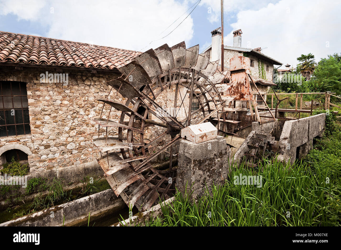 Old water mill with iron water wheel Stock Photo Alamy