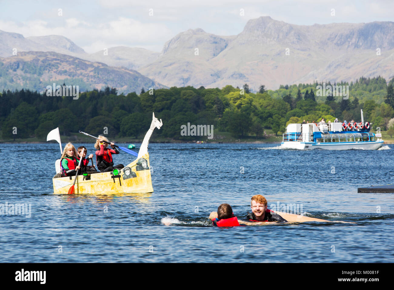 The annual Low Wood, no wood, cardboard boat race on Lake Windermere, Lake District, UK. Stock Photo