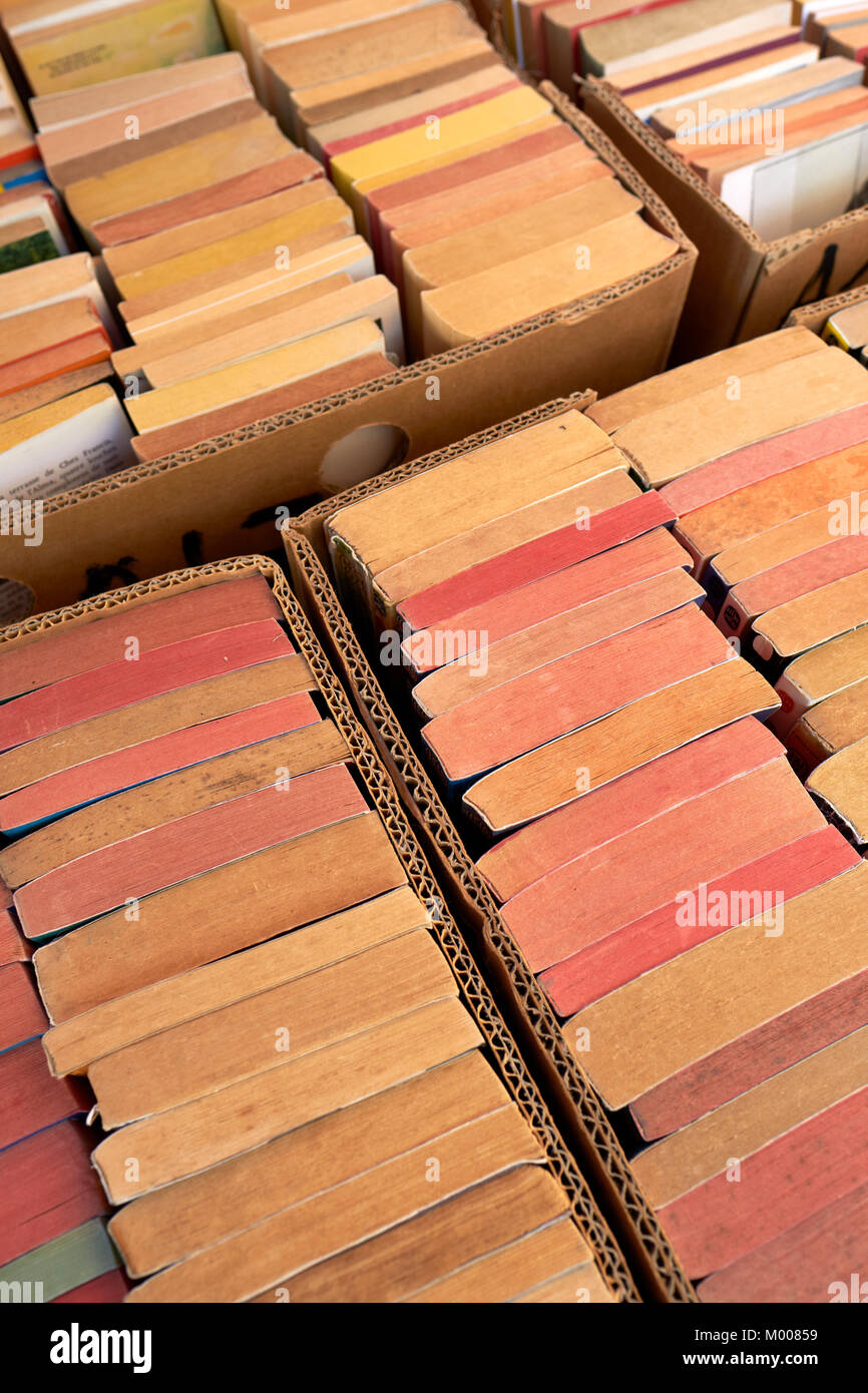 Second hand paperback books for sale on a market stall - paperback books background Stock Photo