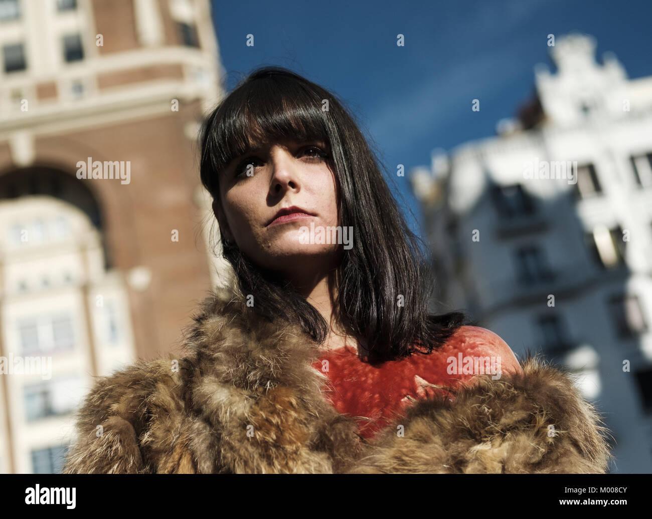 Wears a fake fur coat during a demonstration to protest against hi-res ...