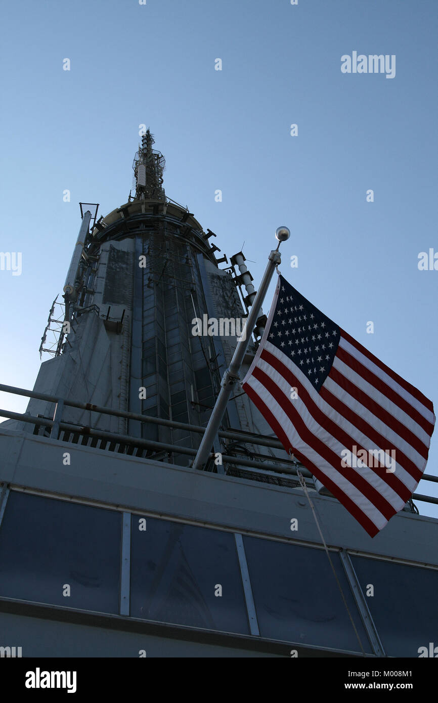 The Empire State Building rooftop broadcast Stations antennae and American Flag, New York City