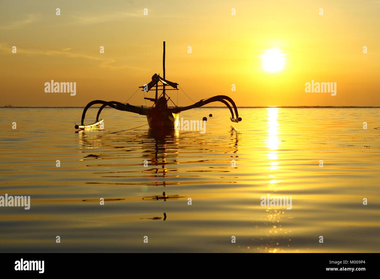 Fishing boat at sunrise Stock Photo