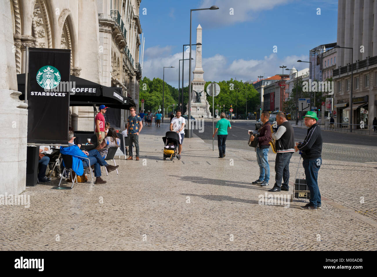 People relaxing outside Starbucks Cafe, Lisbon, Portugal Stock Photo