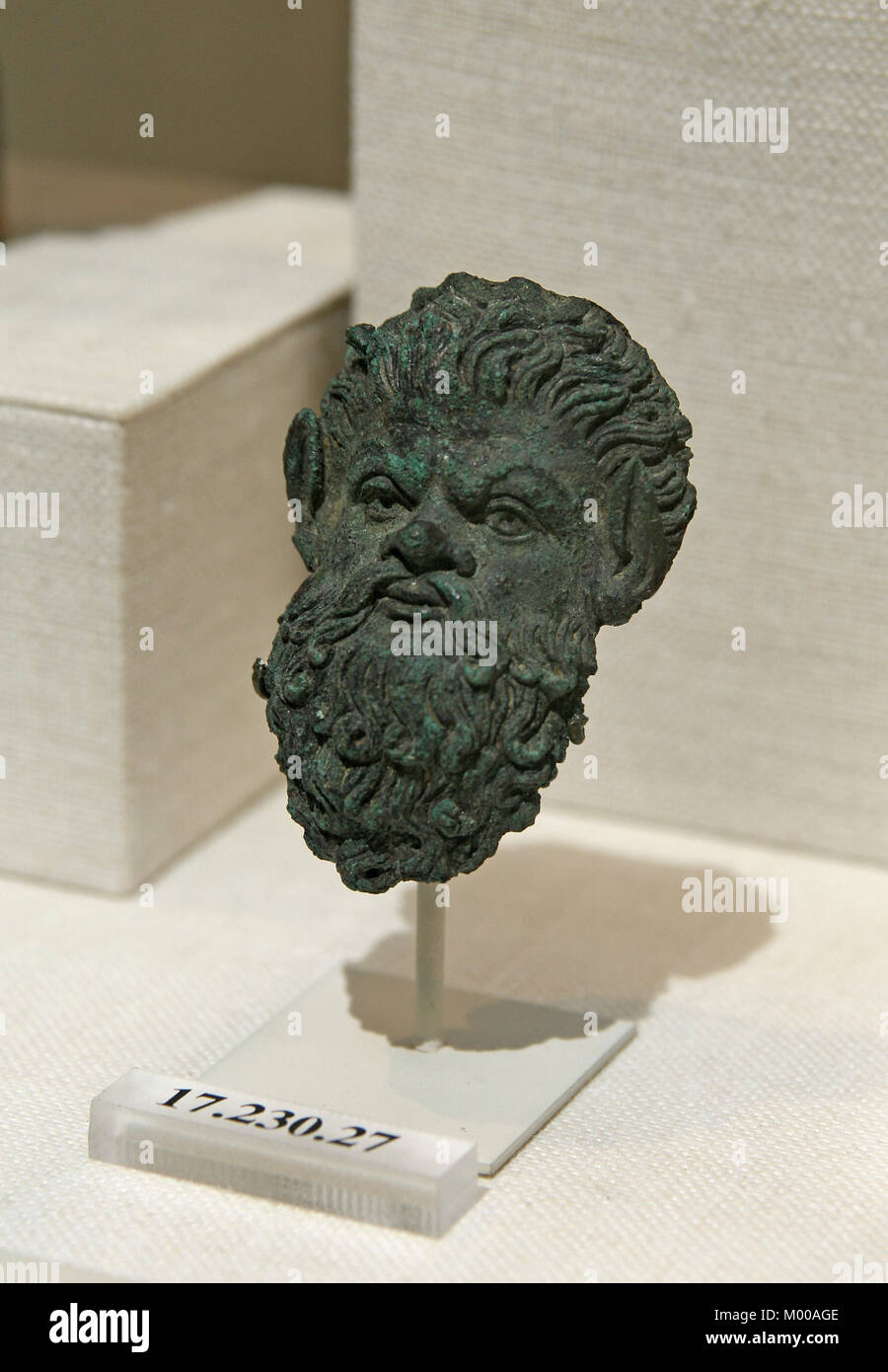 Bronze handle attachment in the form of a satyr mask, Hellenistic, Greek 2nd century BC, The Metropolitan Museum of Art (The Met), Upper Manhattan, Ne Stock Photo