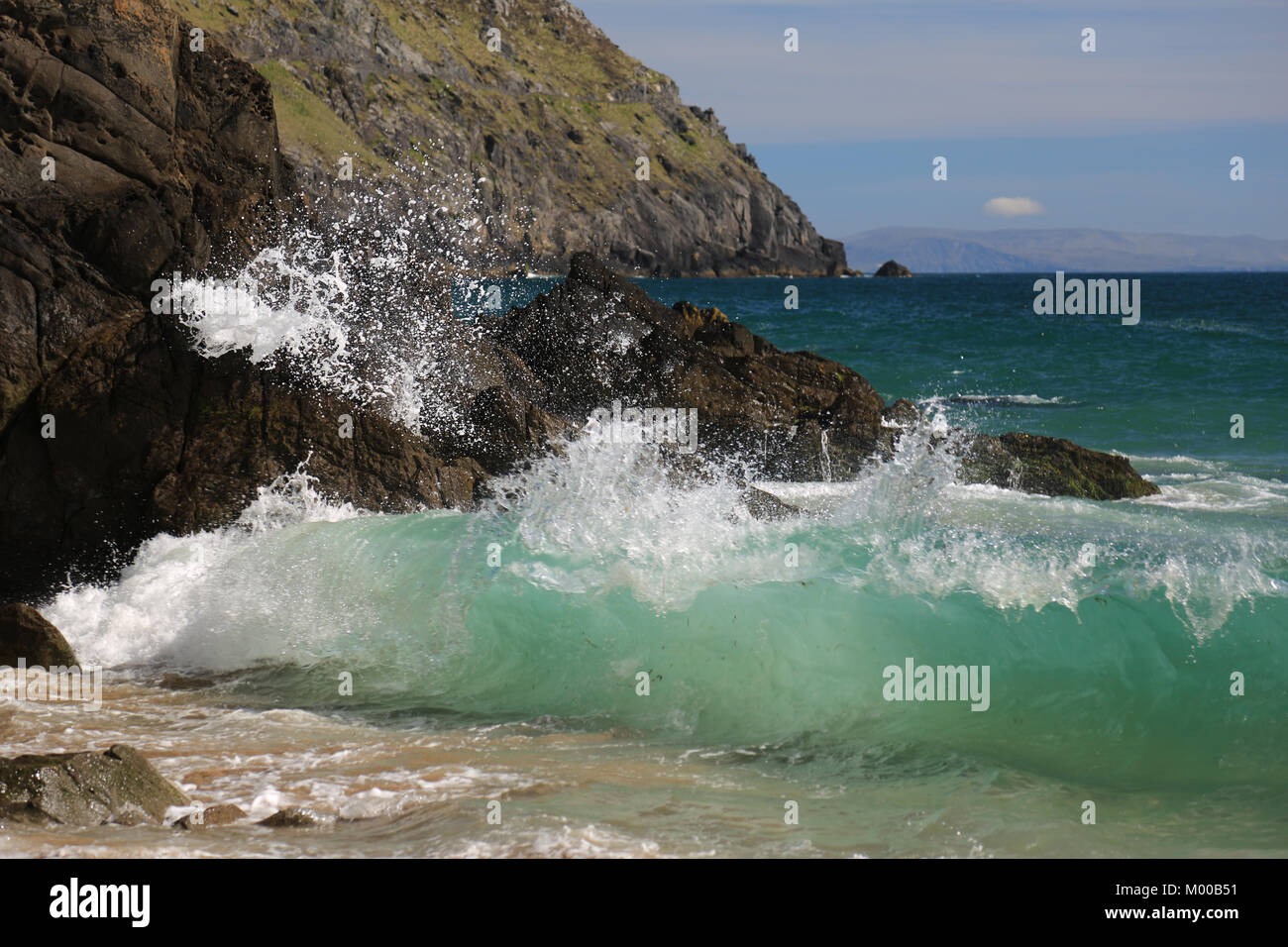 Waves crashing against the rocks and shoreline in Ireland, Wild Atlantic Way Stock Photo