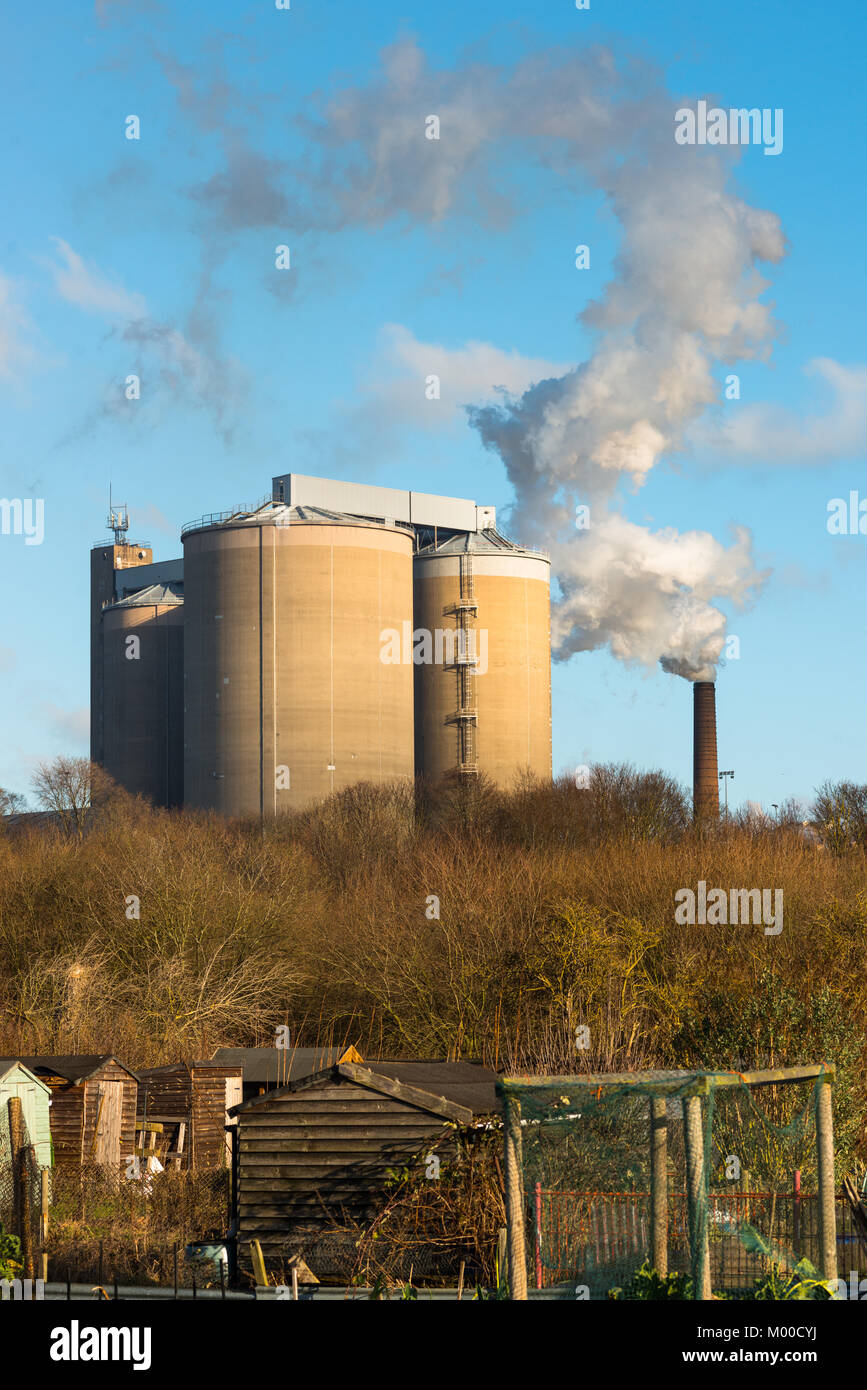 Smoke bellowing out of a chimney at British Sugar factory at Bury St Edmunds, Suffolk, East Anglia, England, UK. Stock Photo