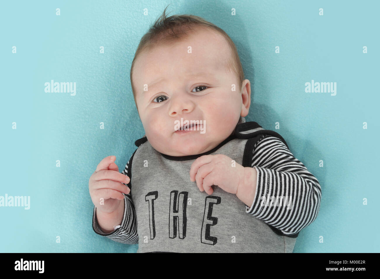 happy 9 week old baby boy on a blanket Stock Photo