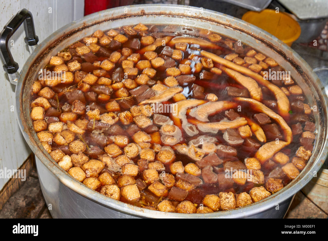 A pot of pig offal simmering at a Bangkok, Thailand street food stall Stock Photo