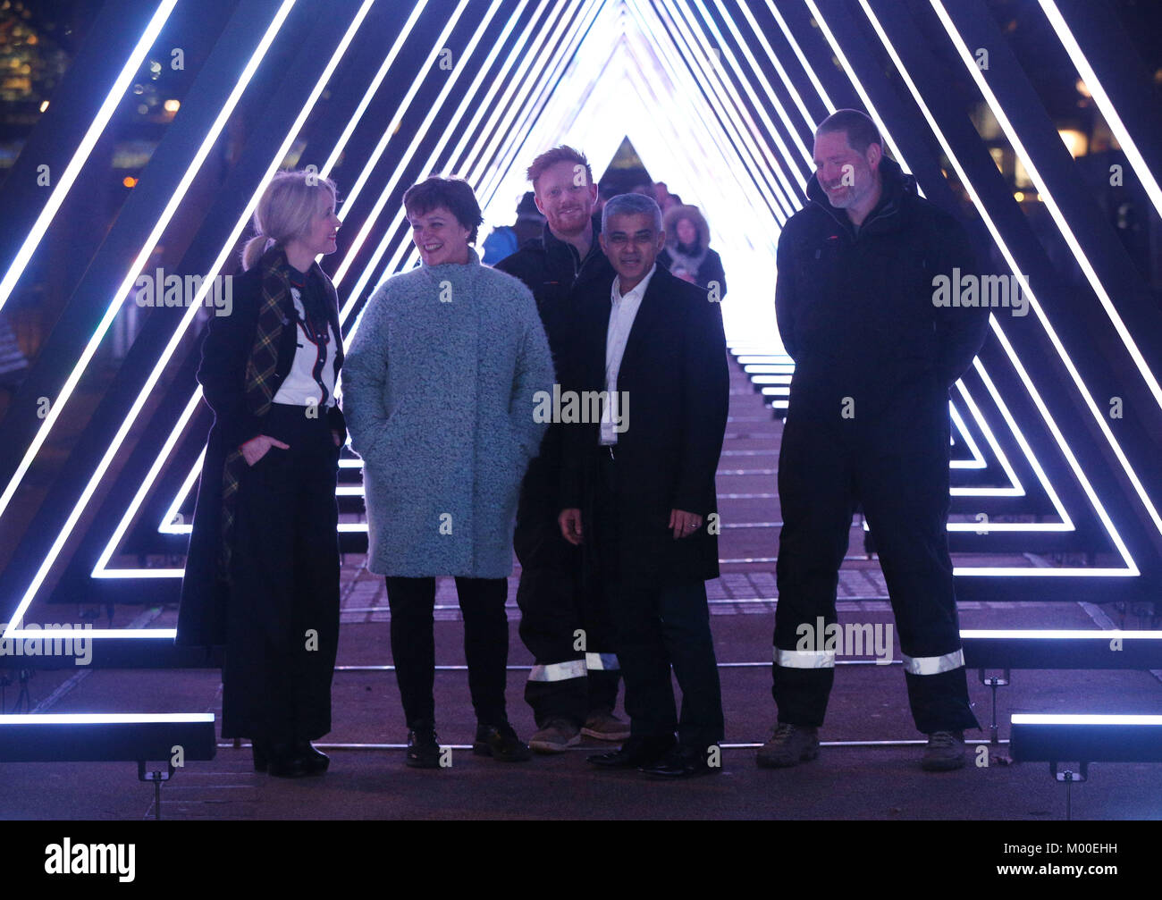 (Left-right front) Deputy Mayor of Culture and Creative Industries Justin Simmons, Director of Artichoke and Lumiere London Artistic Director Helen Marriage and Mayor of London Sadiq Khan next to The Wave by Vertigo on the Riverside Walkway, South Bank, during the Lumiere London light. Stock Photo