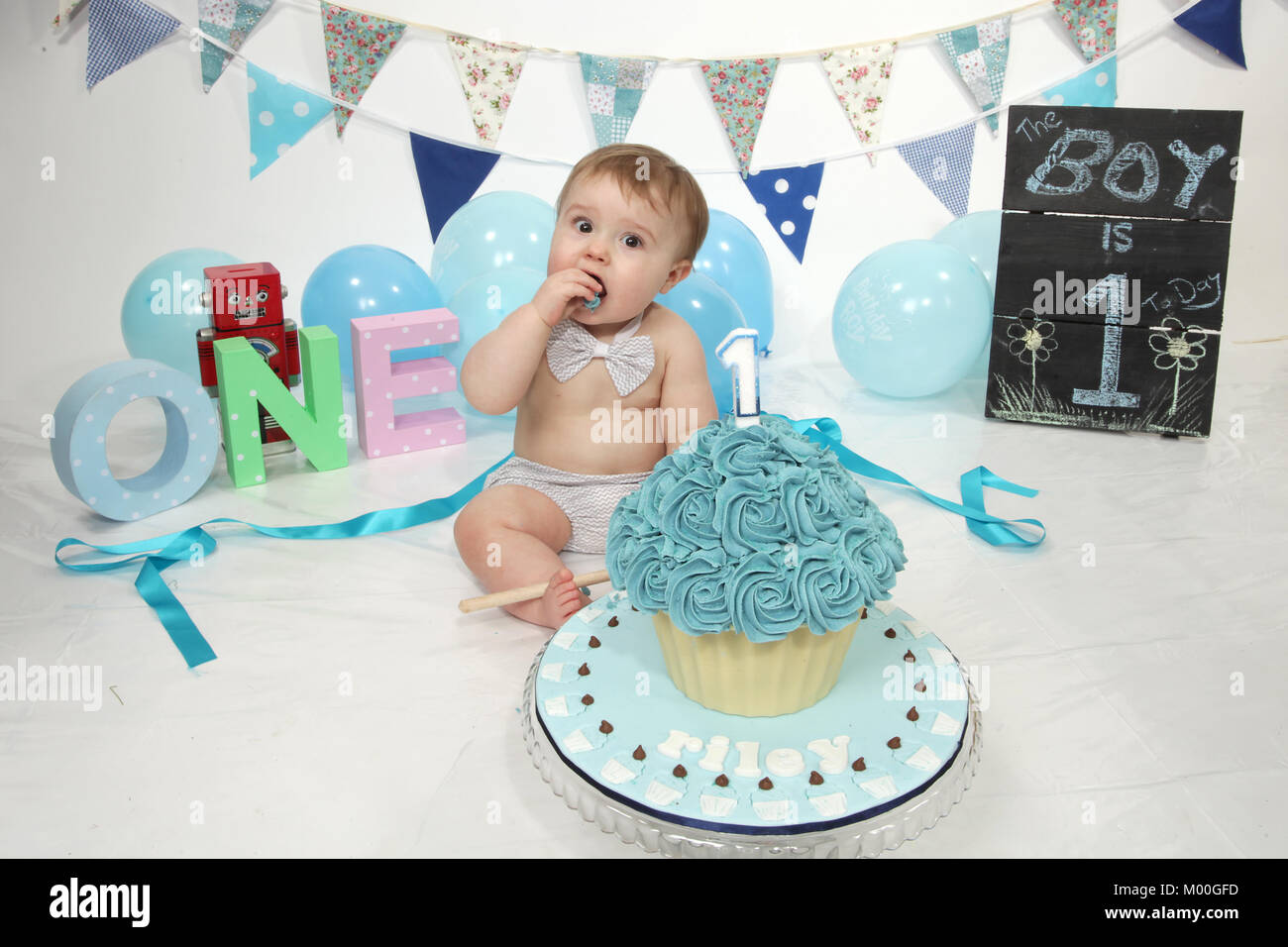 1 year old boy birthday party cake smash, fun food Stock Photo - Alamy