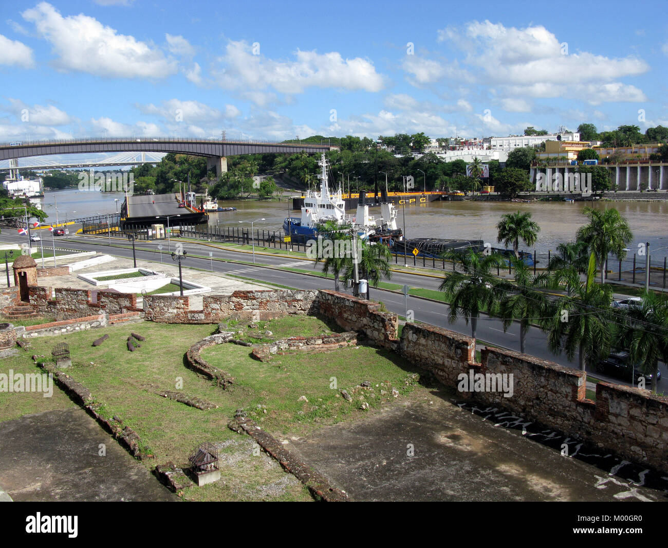Santo Domingo, officially Santo Domingo de Guzmán, is the capital of the Dominican Republic. Caribbean Zona Colonial Rio Ozama and Puente Juan Pablo D Stock Photo