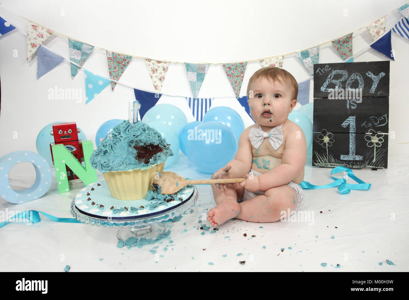 1 year old boy birthday party cake smash, fun food Stock Photo - Alamy