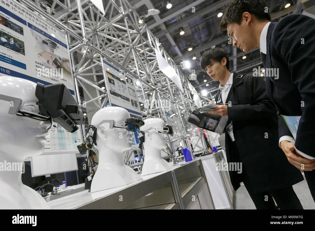 Robodex Tokyo, Japan. January 17, 2018. Visitors look at prototypes of 3D-AR ...