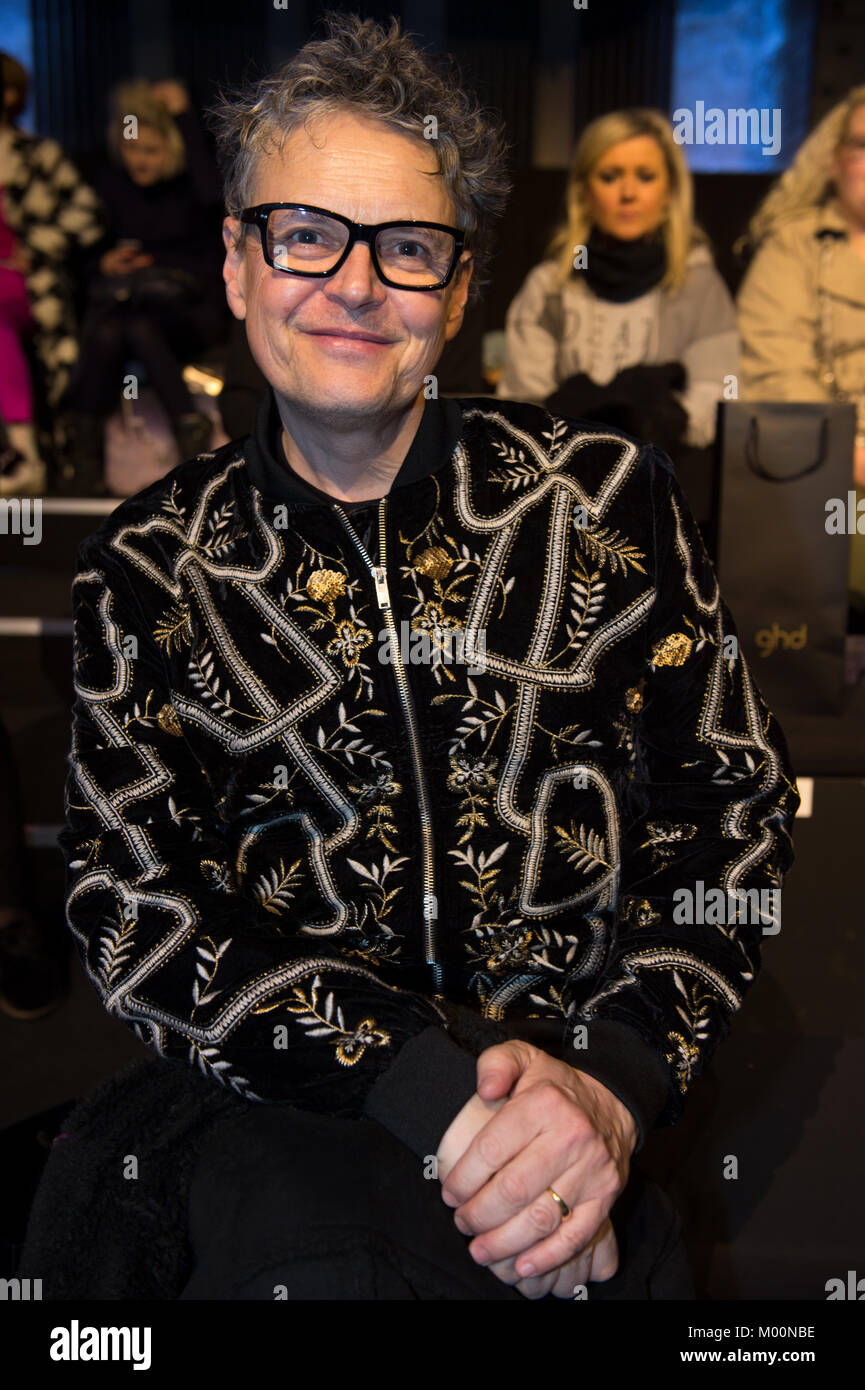 Berlin, Germany. 17th Jan, 2018. The casting director Rolf Scheider sits at the show of designer Irene Luft during the Mercedes-Benz Fashion Week at the E-Werk in Berlin, Germany, 17 January 2018. The collections for autumn/winter 2018/19 are being presented at the Berlin Fashion Week. Credit: Lisa Ducret/dpa/Alamy Live News Stock Photo