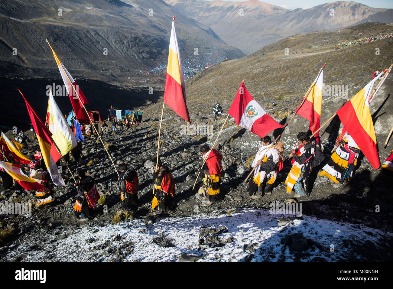 Cusco, Peru. 29th Dec, 2017. Members of the Nation Acomayo descends from Ausangate Mountain, at 6362m, the snow covered has been affected by the climate change, years ago this area is covered by snow.Quyllur Rit'i or Star Snow Festival is a spiritual and religious festival held Annually at the Sinakara Valley in the Cusco Region of Peru. Groups of Quero indigenous people climb Ausangate Mountain, at 6362m, in search of the Snow Star Which is reputedly buried Within the mountain.According to the chroniclers, the Qoyllur Rit'i is the Christ that the Church sent painted on a rock at almost Stock Photo