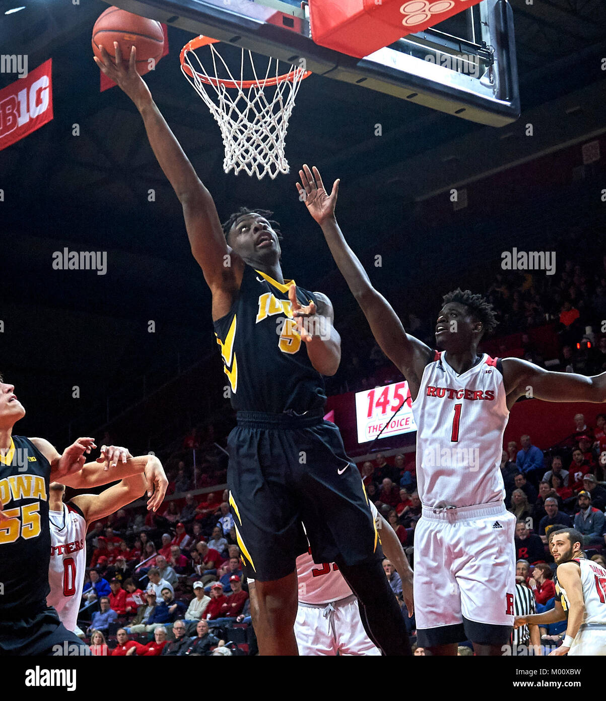 Piscataway, New Jersey, USA. 17th Jan, 2018. Iowa Hawkeyes forward Tyler Cook (5) scores underneath the basket as Rutgers Scarlet Knights forward Candido Sa (1) tries to defend during the first half between the Iowa Hawkeyes and the Rutgers Scarlet Knights at Rutgers Athletic Center in Piscataway, New Jersey. Duncan Williams/CSM/Alamy Live News Stock Photo