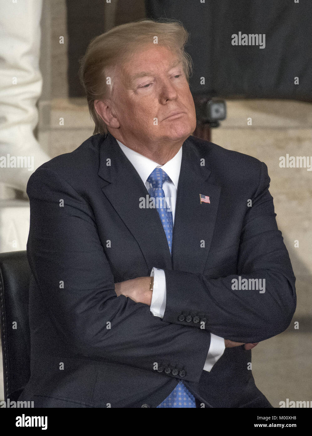January 17, 2018 - Washington, District of Columbia, United States of America - United States President Donald J. Trump listens to remarks as he attends a Congressional Gold Medal ceremony honoring former US Senator Bob Dole (Republican of Kansas) in the Rotunda of the US Capitol on Wednesday, January 17, 2017. Congress commissioned gold medals as its highest expression of national appreciation for distinguished achievements and contributions. Dole served in Congress from 1961 through 1996, was the Senate GOP leader from 1985 through 1996, and was the 1996 Republican Party nominee for Presid Stock Photo