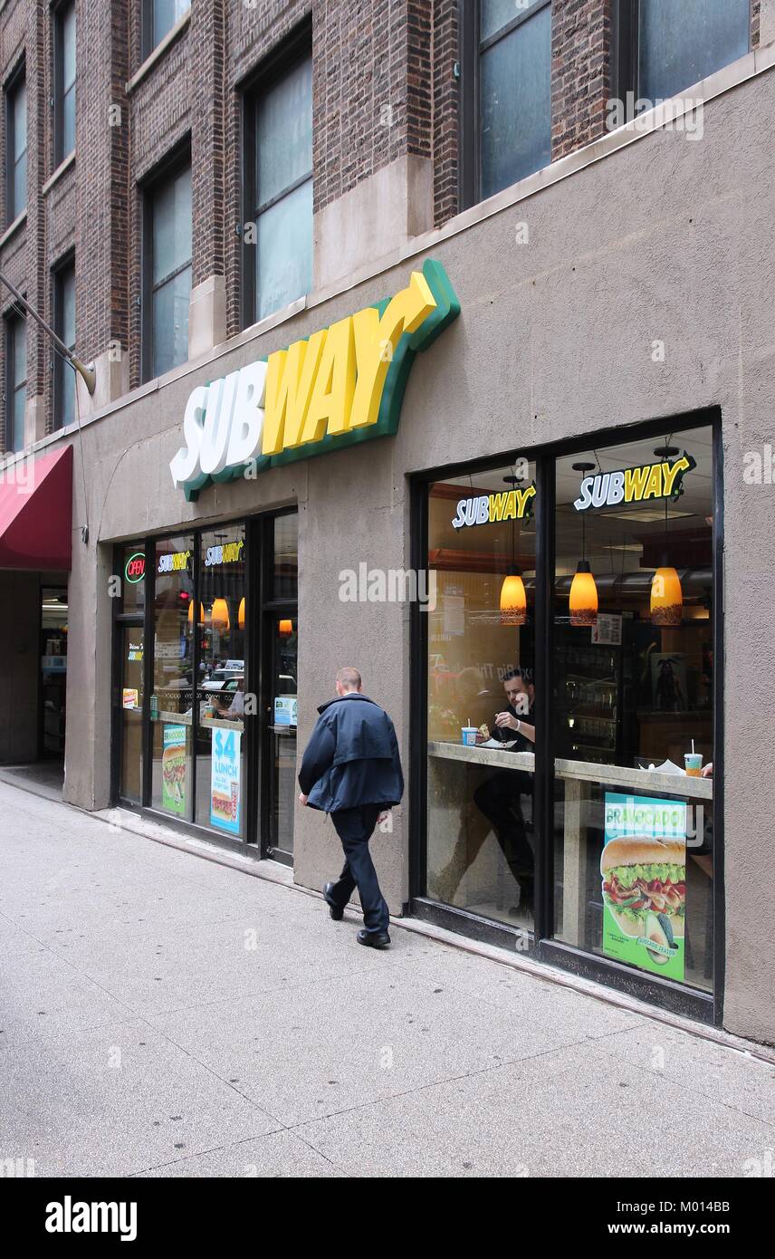 CHICAGO - JUNE 26: People eat at Subway sandwich store on June 26, 2013 in Chicago. Subway is one of fastest growing restaurant franchises with 39,747 Stock Photo