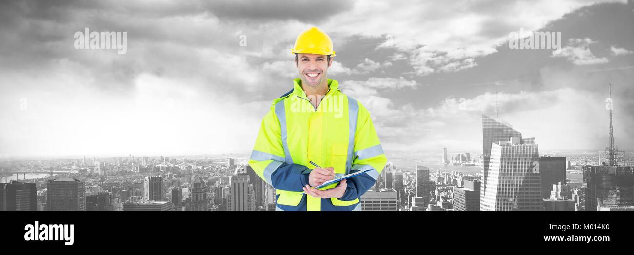 Construction Worker over large city buildings Stock Photo