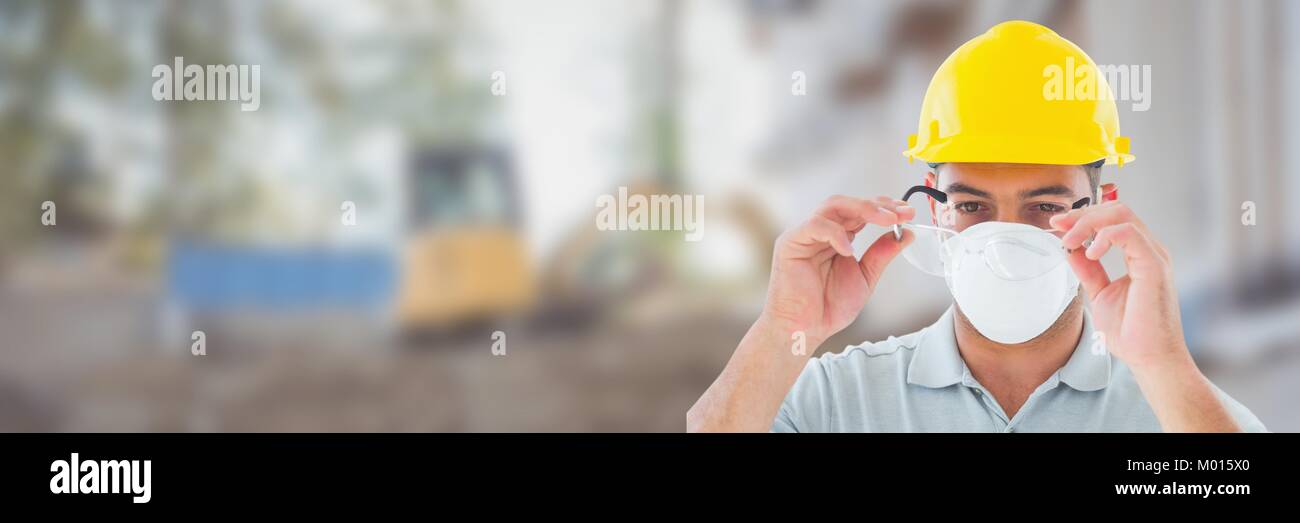Construction Worker on building site wearing mask Stock Photo
