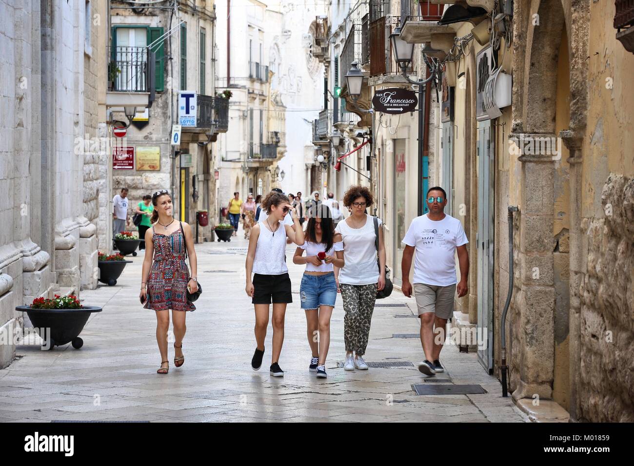 ALTAMURA, ITALY - JUNE 4, 2017: People visit Old Town of Altamura in Italy. Altamura is a major city in Apulia, with population of 70,556. Stock Photo