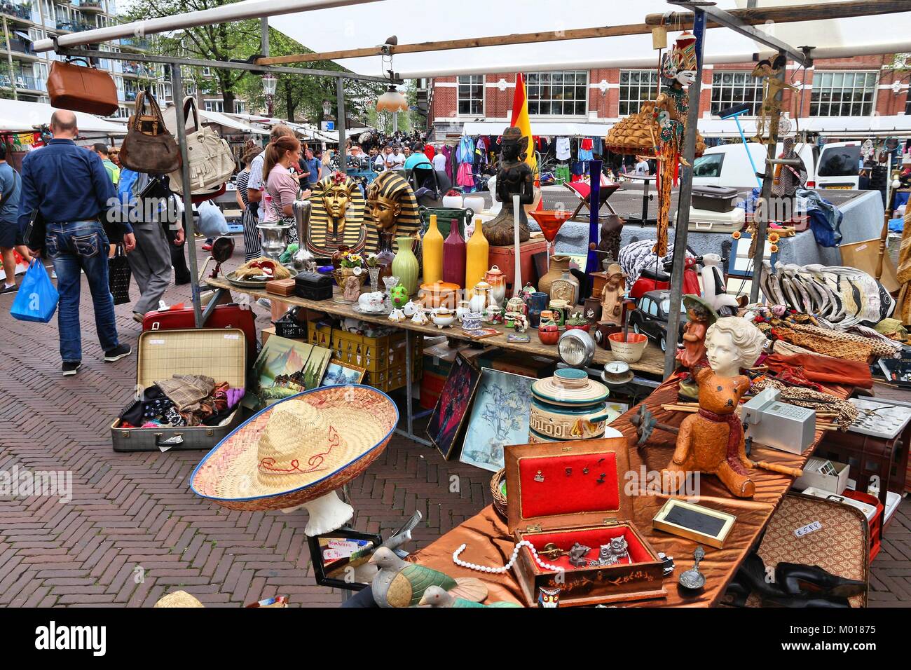 AMSTERDAM, NETHERLANDS - JULY 8, 2017: People visit Waterlooplein Market in Amsterdam, Netherlands. The popular flea market has up to 300 stalls. Stock Photo