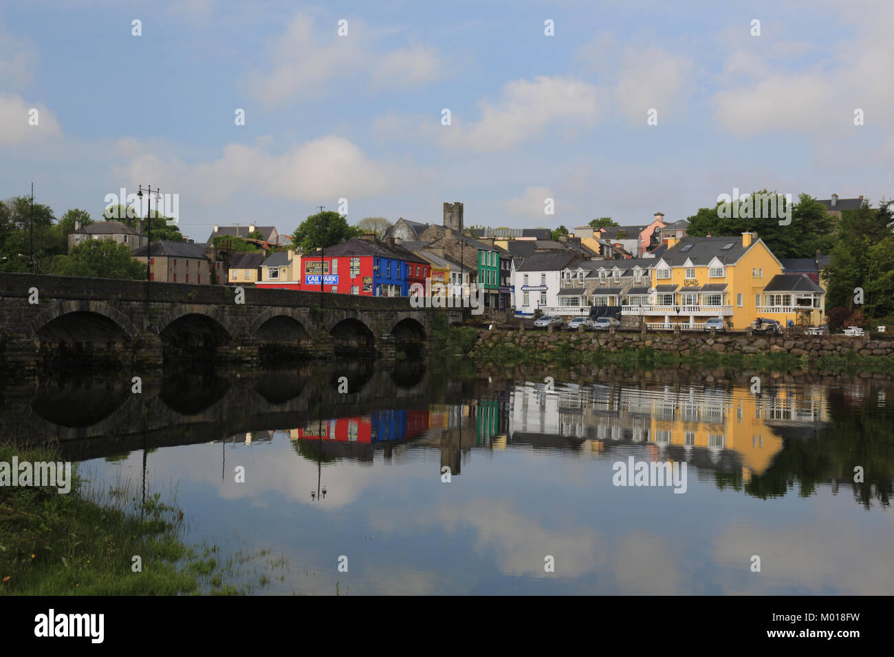 rural irish town reflected in the river laune, killoirglin, wild