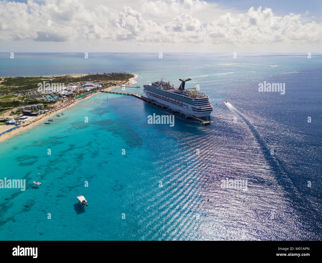 GRAND TURK, TURKS AND CAICOS-DECEMBER 11, 2017: The Carnival Sunshine cruise ship docks in Grand Turk in the Turks and Caicos Islands in this aerial v Stock Photo