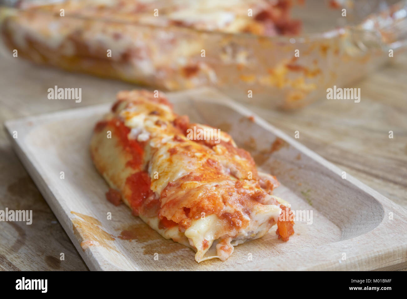 cannelloni filled with ground beef and covered with mozzarella and