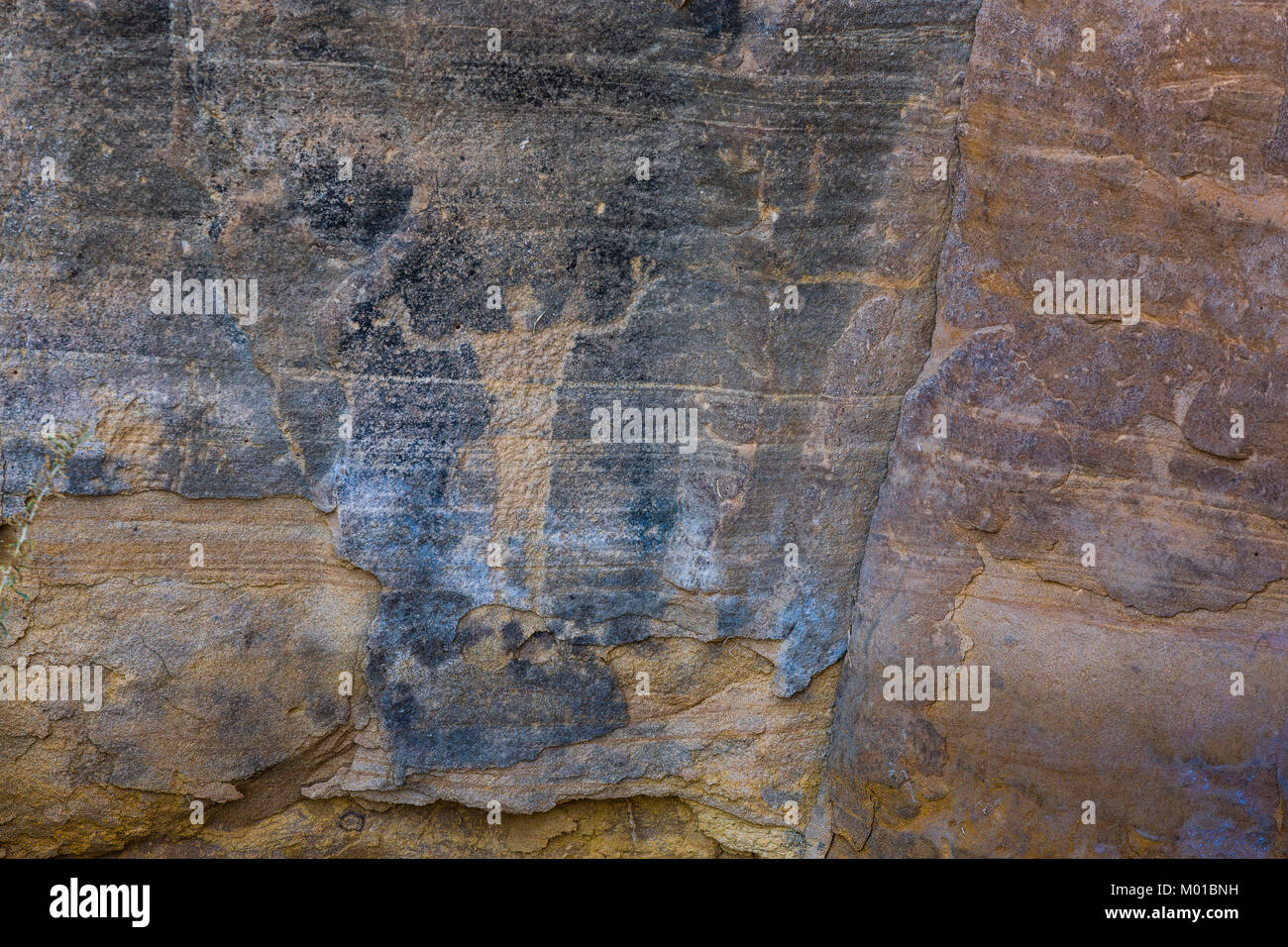 Pictograph of a human figure with arms raised, perhaps a shaman, created by a member of the Fremont Culture, Nine Mile Canyon, Utah, USA Stock Photo