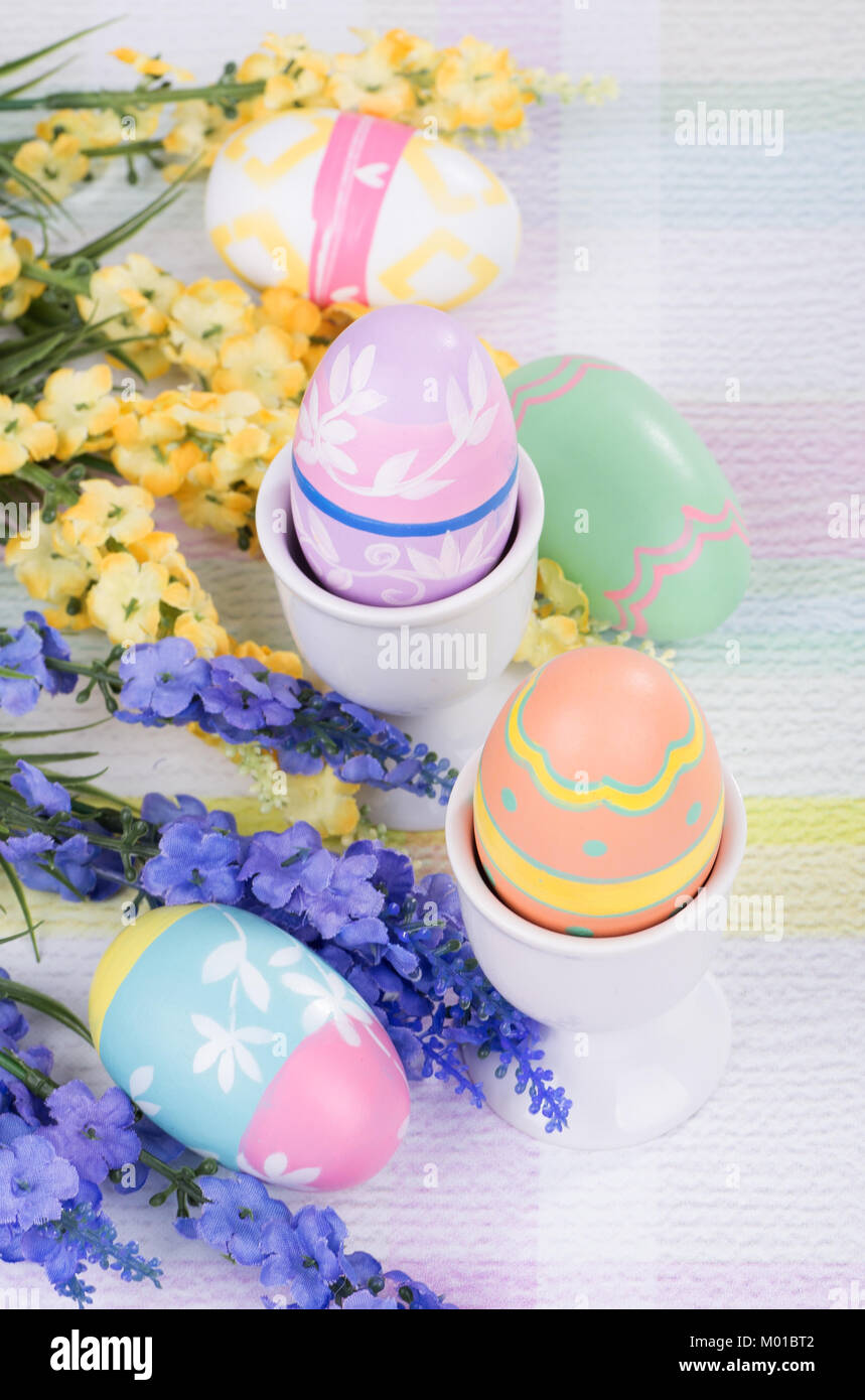 Decorative Easter Eggs And Egg Cups With Flowers Stock Photo