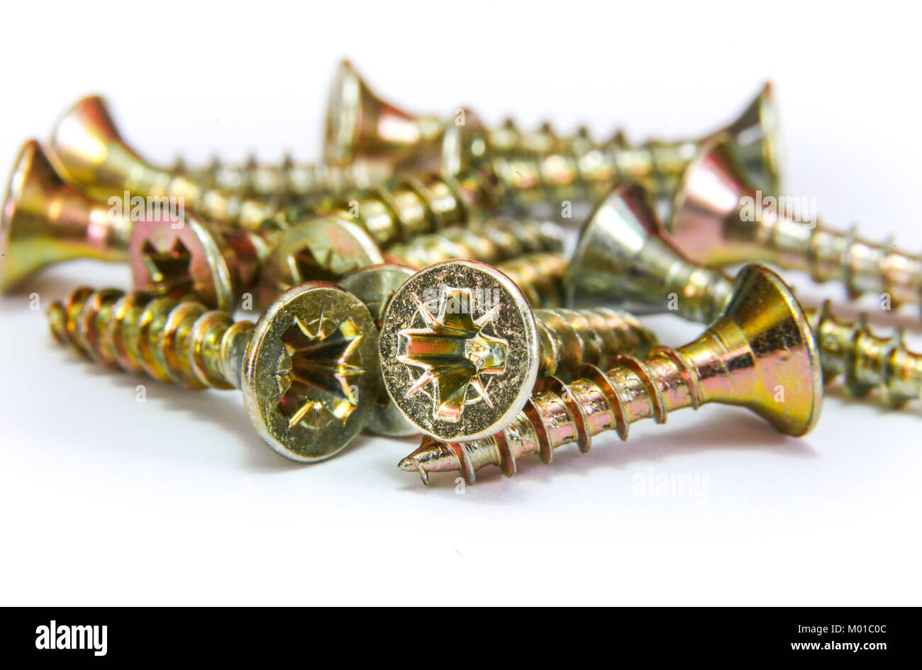 Bunch of yellow zinc coated philips flat head cross screws fasteners