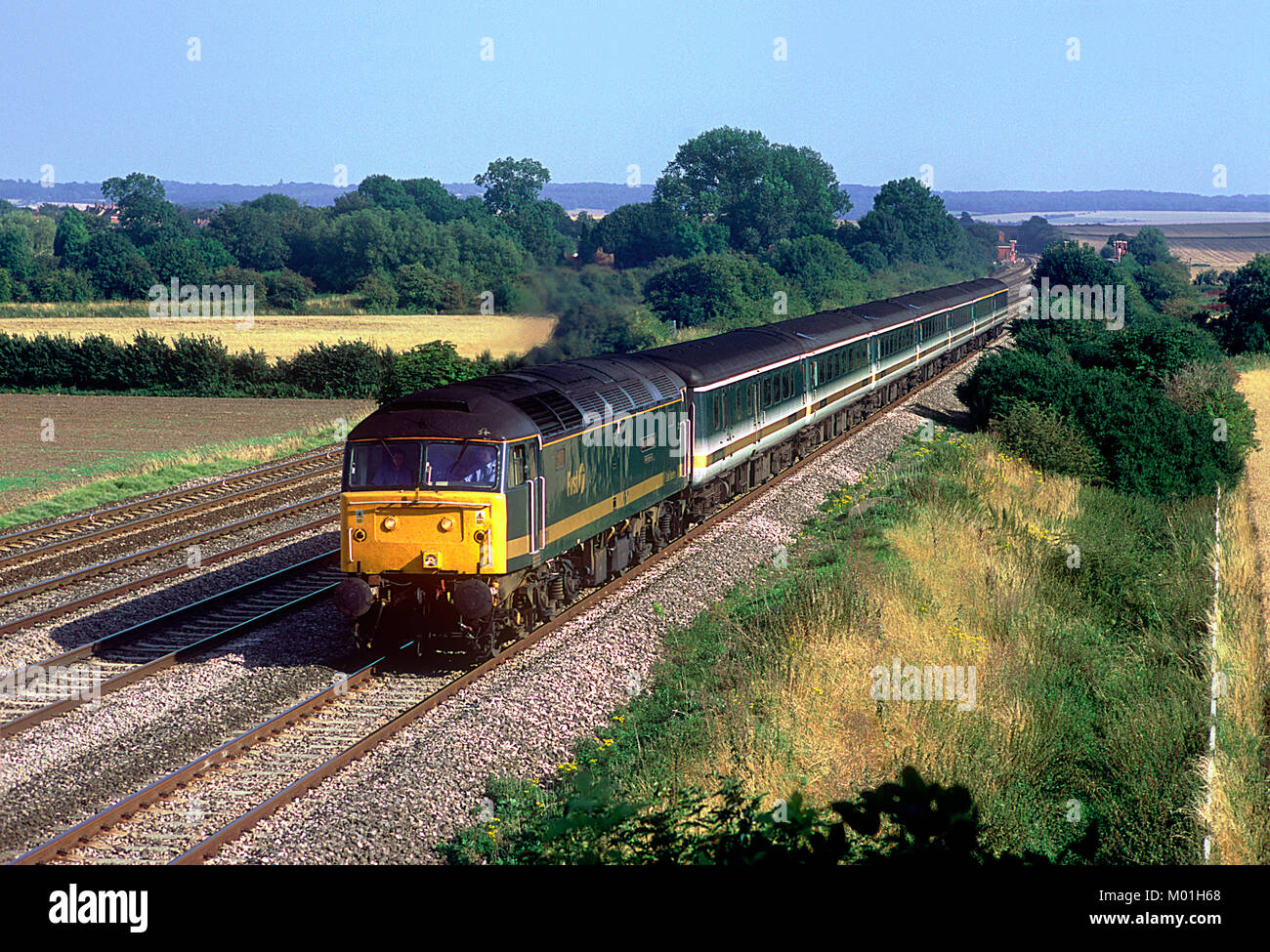 A class 47 diesel locomotive number 47816 'Bristol Bath Road Quality Approved'  working a First Great Western service at Cholsey. 14th August 2002. Stock Photo
