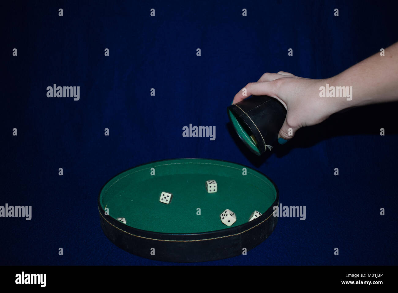 Rolling dice gambling game Stock Photo Alamy