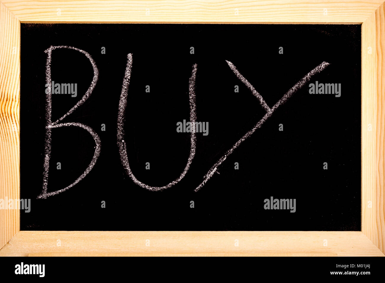 Blackboard with buy written on in white chalk Stock Photo Alamy