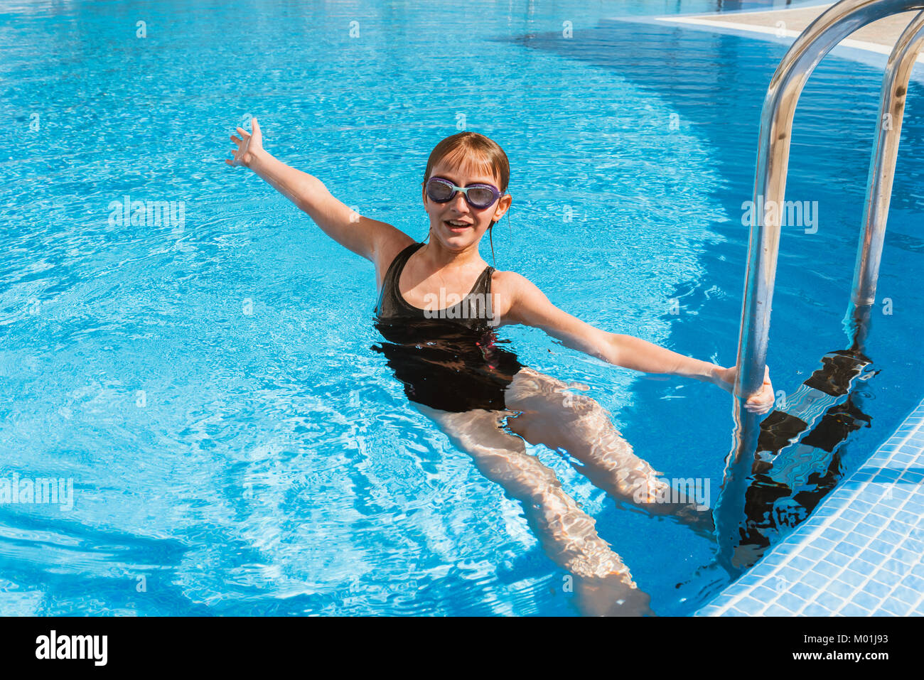 Cute teen girl in swimming pool Stock Photo