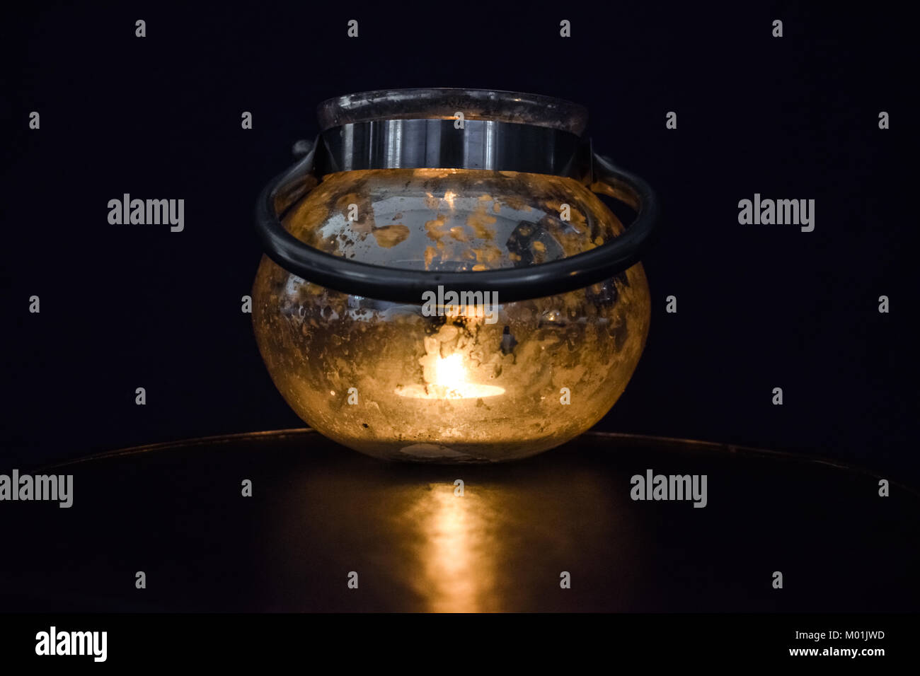 Burning candle in glass Stock Photo