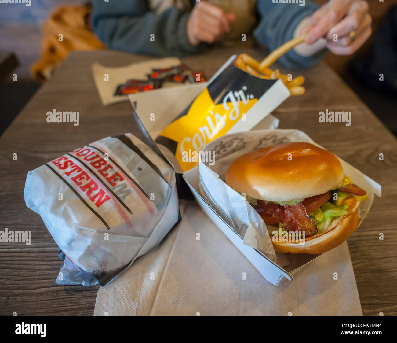 Hamburgers and fries at the first Carl's Jr. in New York in Brooklyn in Coney Island on Saturday, January 13, 2018. The fast food chain with over 1300 restaurants is entering the competitive New York market, opening a second location in Midtown Manhattan at the end of January. The chain, operated by CKE Restaurant Holdings (which also owns the Hardee's brand) has less than 10 of its franchises east of Oklahoma. (Â© Richard B. Levine) Stock Photo