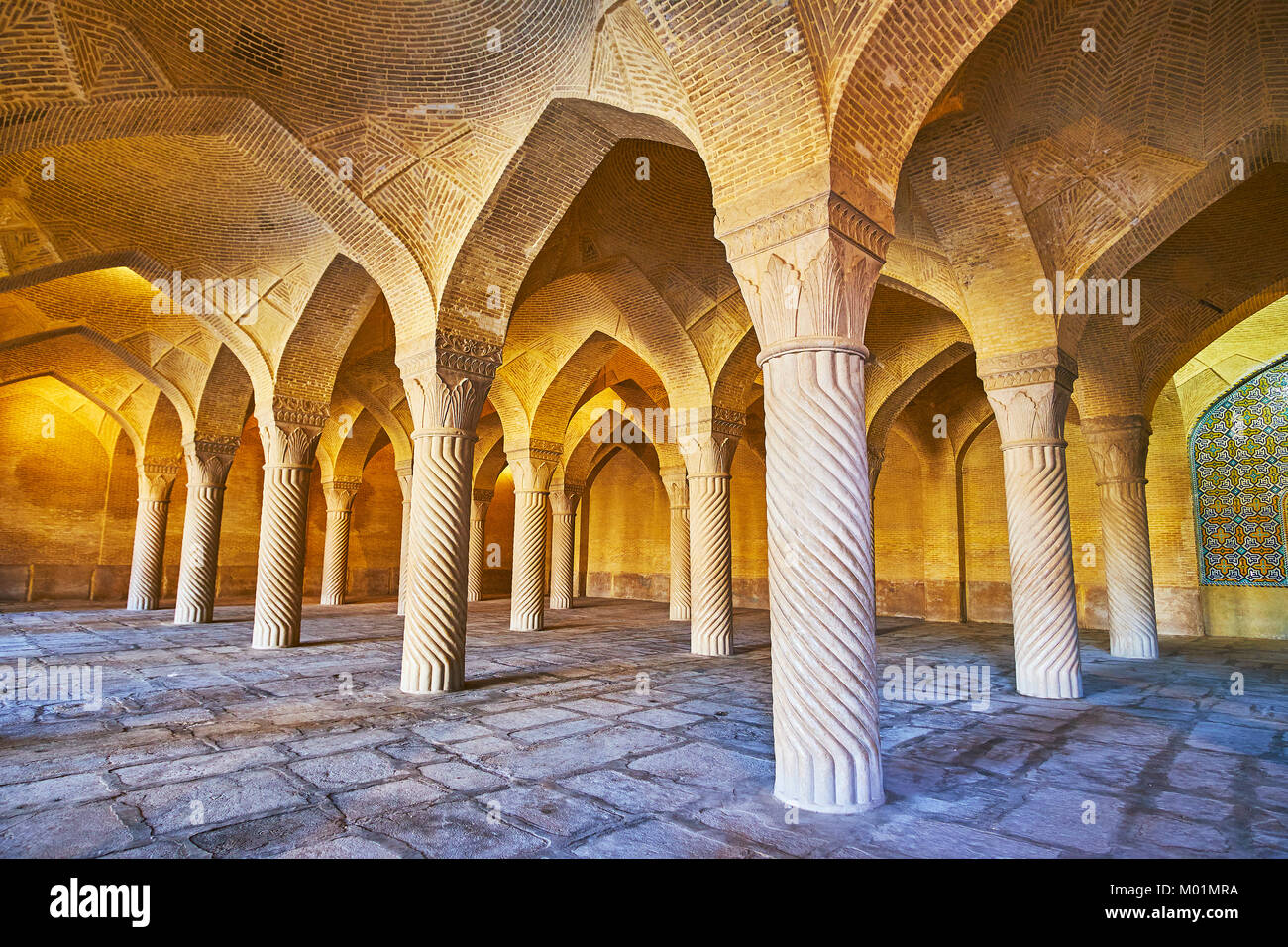 SHIRAZ, IRAN - OCTOBER 12, 2017: The walk among the medieval columns of ...