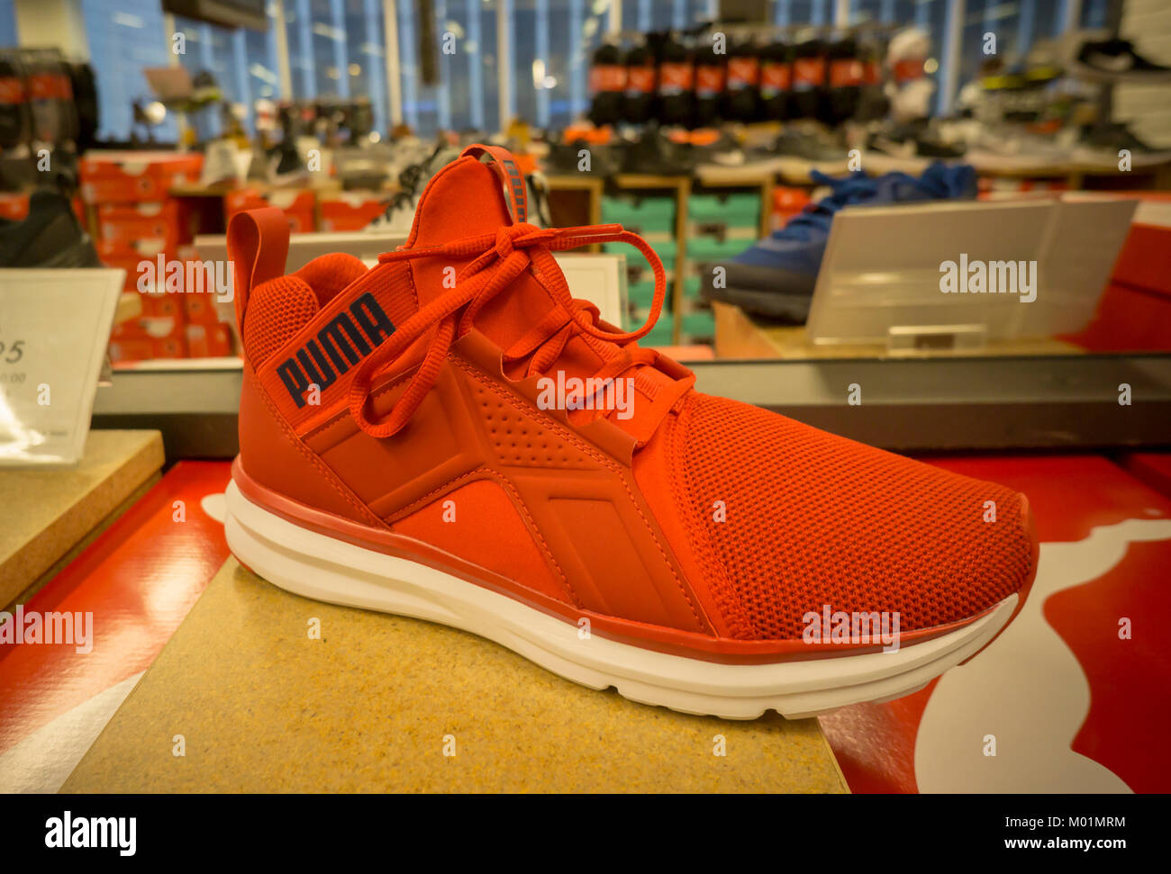A Puma brand sneaker on display in a shoe store in New York on