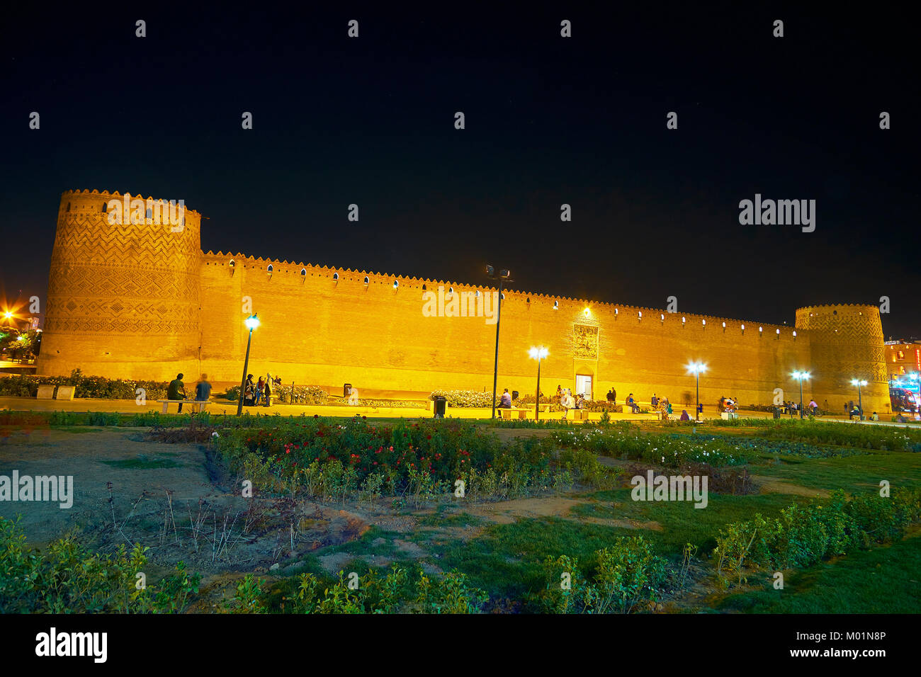 SHIRAZ, IRAN - OCTOBER 12, 2017: The evening panorama of Arg Karim Khan (citadel) with beautiful park on the foreground, on October 12 in Shiraz. Stock Photo