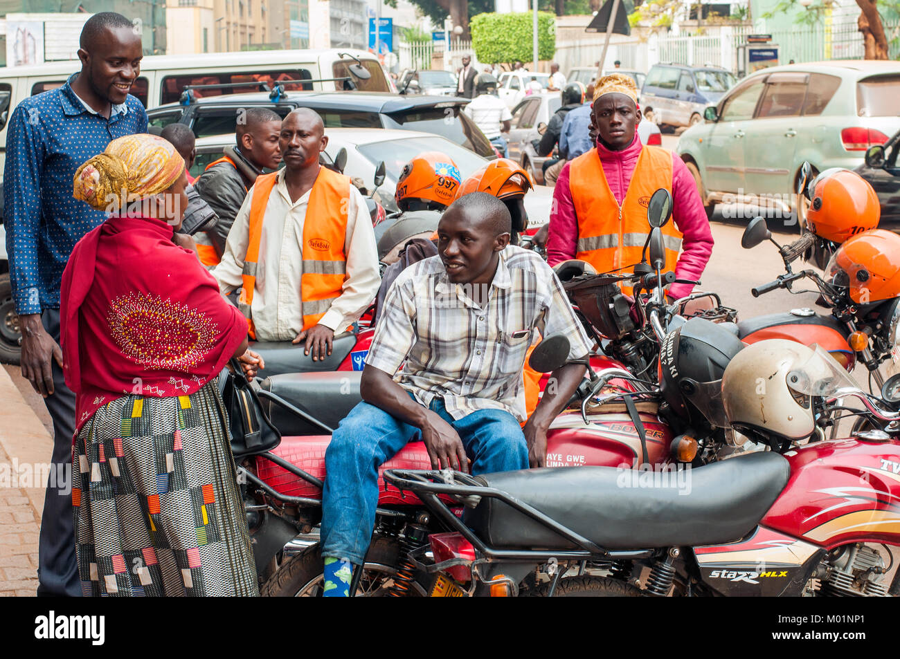 Street scene with boda boda motorcycle taxis, Kampala, Uganda Stock