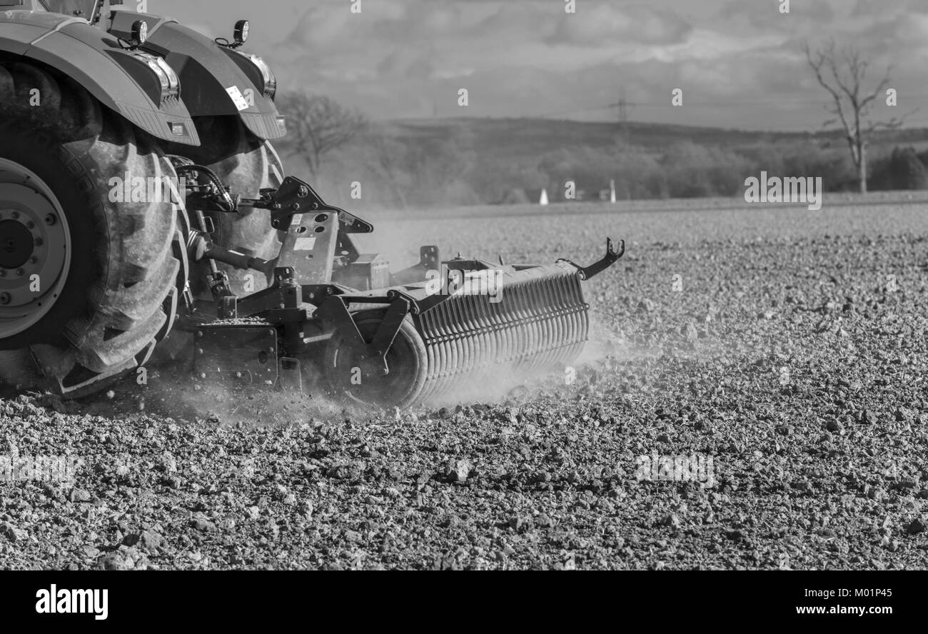 Detail of spring soil cultivation using a power harrow to prepare the soil for sowing in fields near Airth, Falkirk, Scotland, UK. Stock Photo