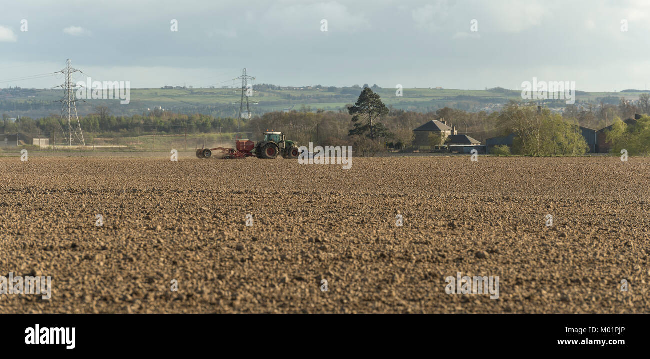 Spring soil cultivation underway in preparation for sowing, by Airth, Falkirk, Scotland, UK. Stock Photo