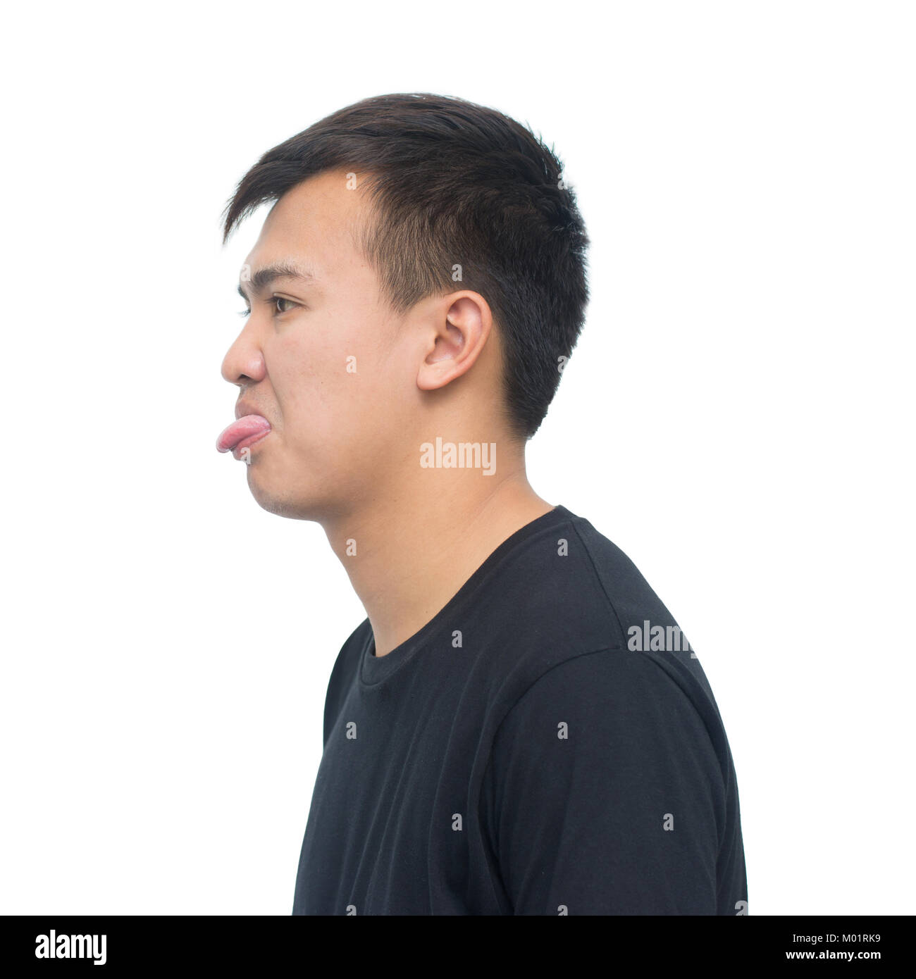 Asian young man showing tongue isolated on white background with clipping path. envious and insult emotions  concept Stock Photo
