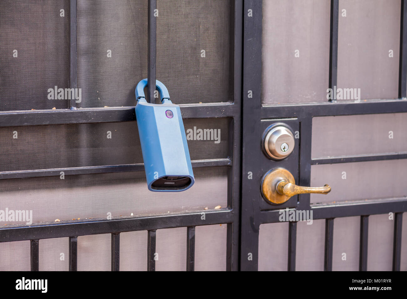 Real Estate lock box on a gate to a house. This way agents have access