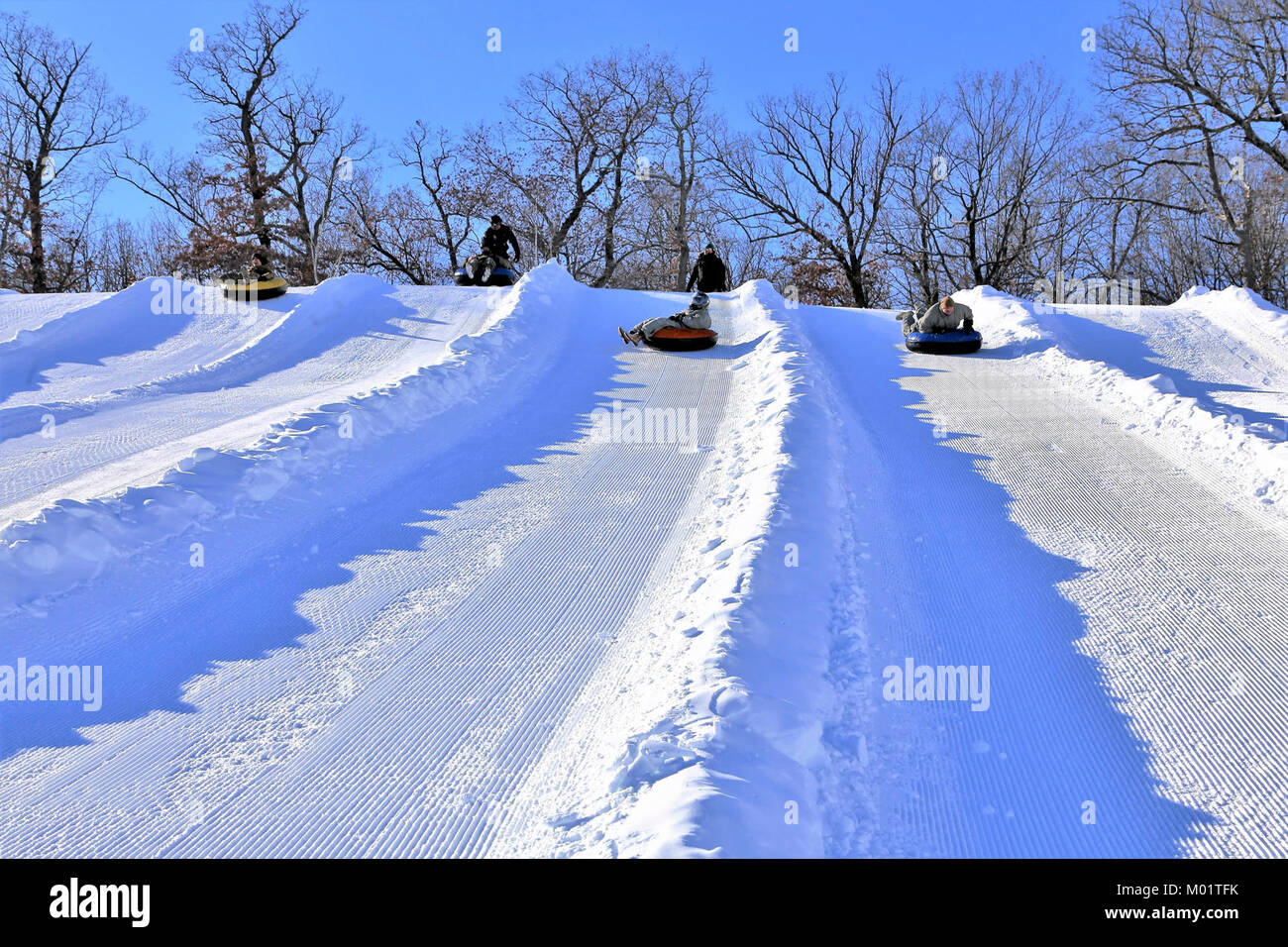 Snowtubers slide down snowtubing lanes at Whitetail Ridge Ski Area on
