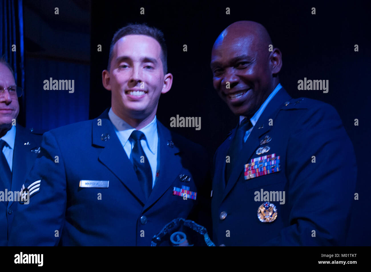 The Nevada Air National Guard's 2017 Airman of the Year, Senior Airman Andrew Marshall of the 152nd Maintenance Squadron accepts his award from Assistant Adjutant General, Brig. Gen. Ondra Berry at the 2017 Outstanding Airmen of the Year Banquet at the Eldorado Resort Casino in Reno on Saturday, January 6, 2018. Stock Photo
