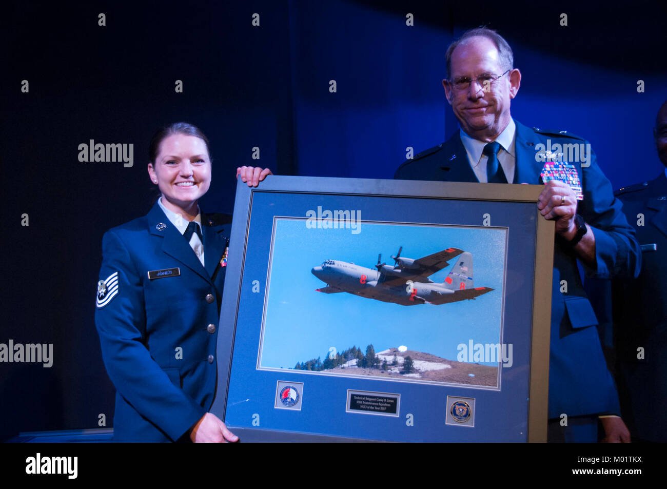 The Nevada Air National Guard's 2017 Noncommissioned Officer of the Year, Tech. Sgt. Casey Jones of the 152nd Maintenance Squadron accepts her award from the State of Nevada Adjutant General, Brig. Gen. William Burks at the 2017 Outstanding Airmen of the Year Banquet at the Eldorado Resort Casino in Reno on Saturday, January 6, 2018. Stock Photo