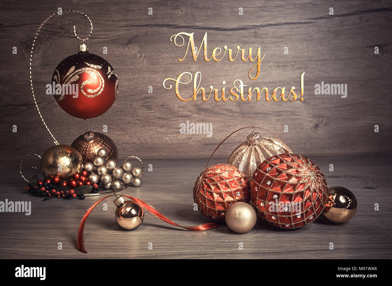 Vintage Christmas background with candles and Christmas baubles, caption "Merry Chistmas!". This